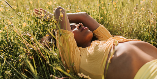 Women lying in natural meadow