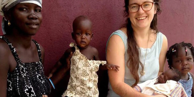 Emily Hill with Ugandan mother and children for Mobilise a Midwife project