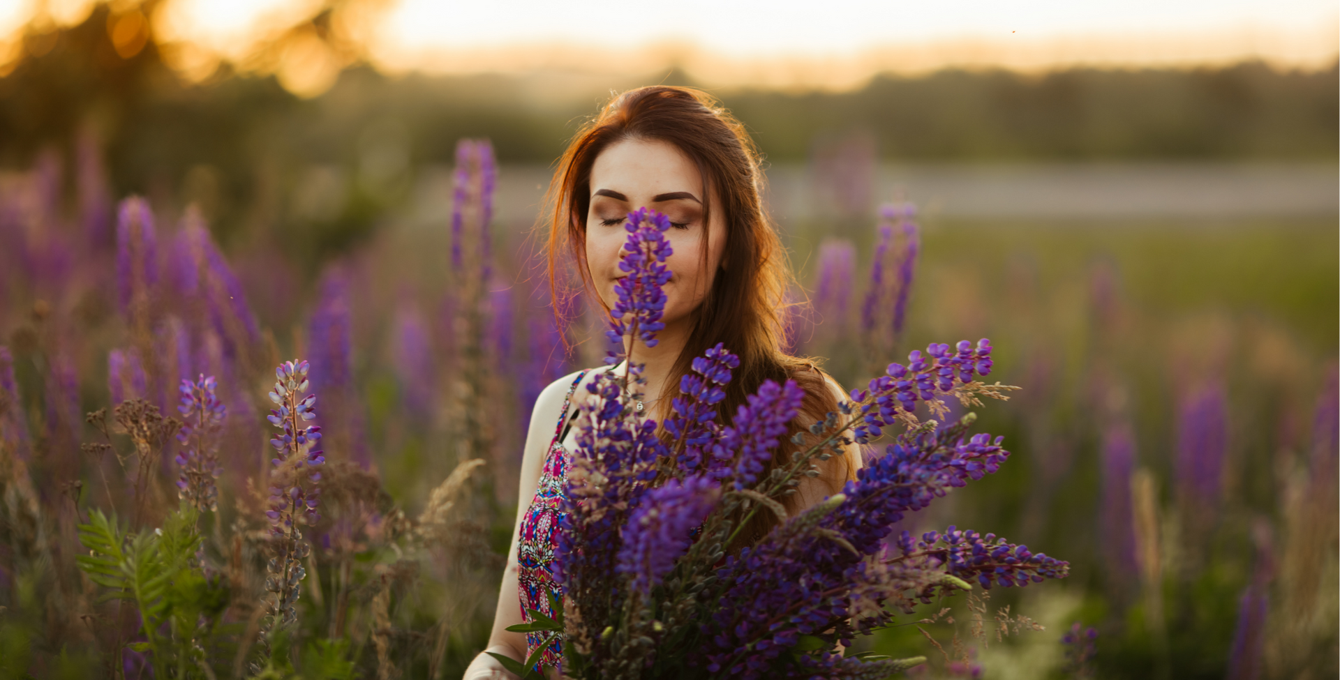 Natural women standing in field of organic flowers