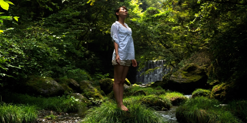 menopausal woman stood in nature