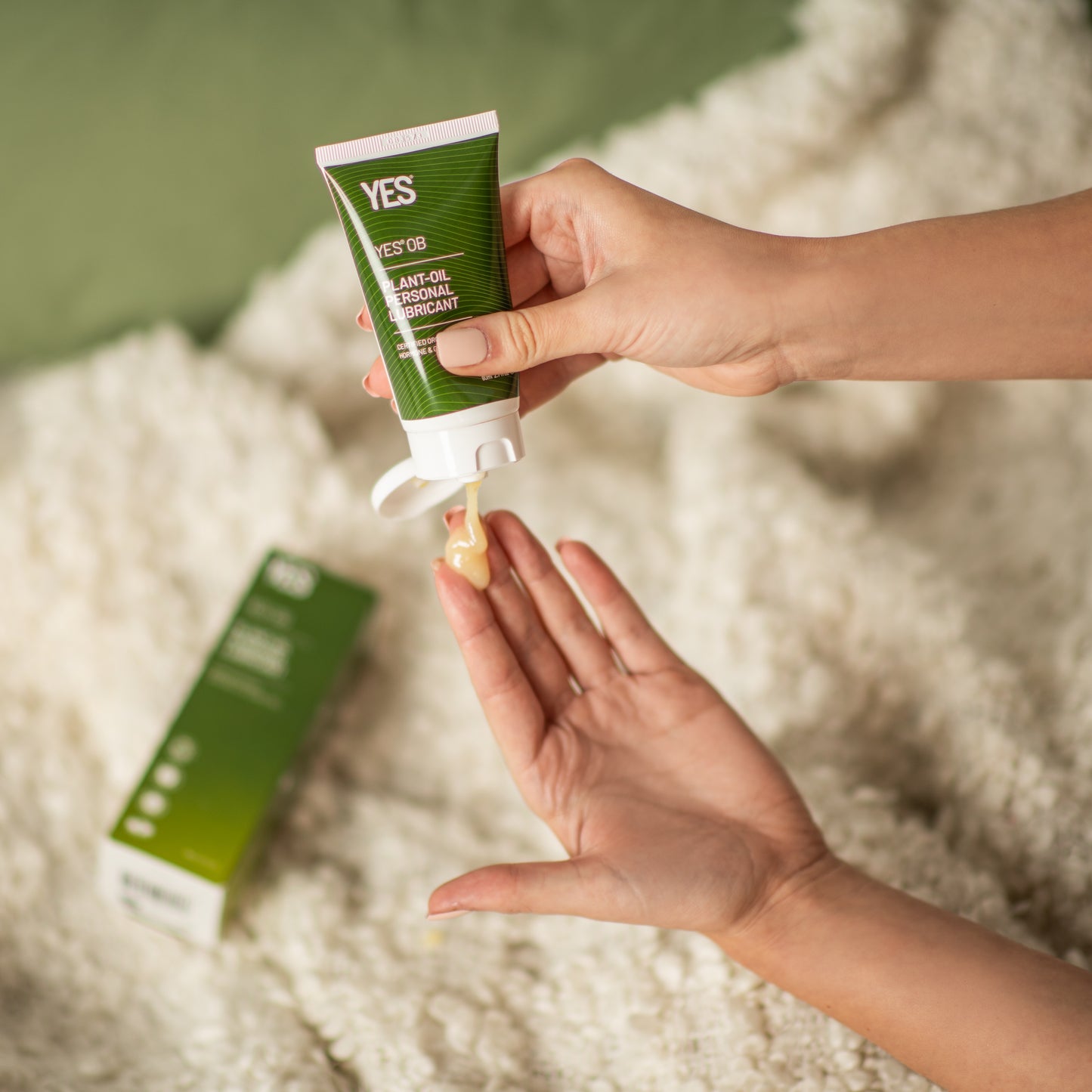 YES OB plant oil based lubricant being dispensed into a hand